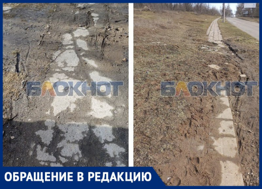 В Днепрорудном жители показали непроходимый тротуар у опасной дороги